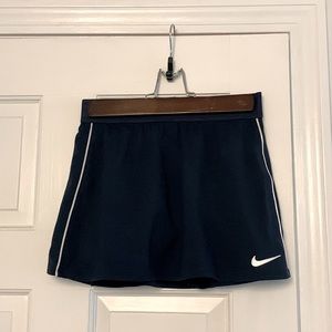 This is a navy tennis skirt with white piping.
